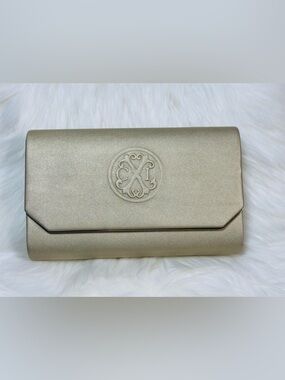 CXL by Christian Lacroix Madison Smooth Clutch is a gold-colored evening bag